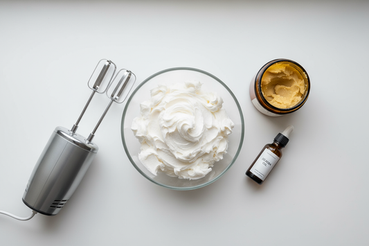 A bowl of homemade DIY whipped shea butter with its ingredients, including Nubiana's raw shea butter, ready for a recipe.