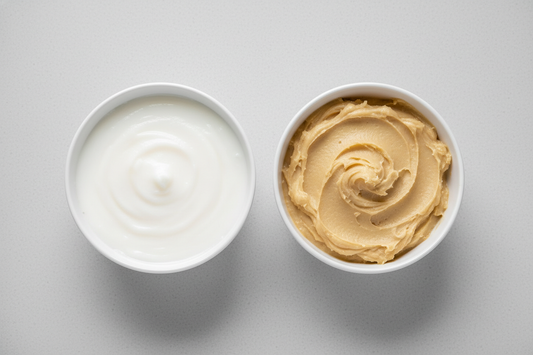 A comparison shot: unrefined, vitamin-rich shea butter (golden) next to refined, processed shea butter (white).