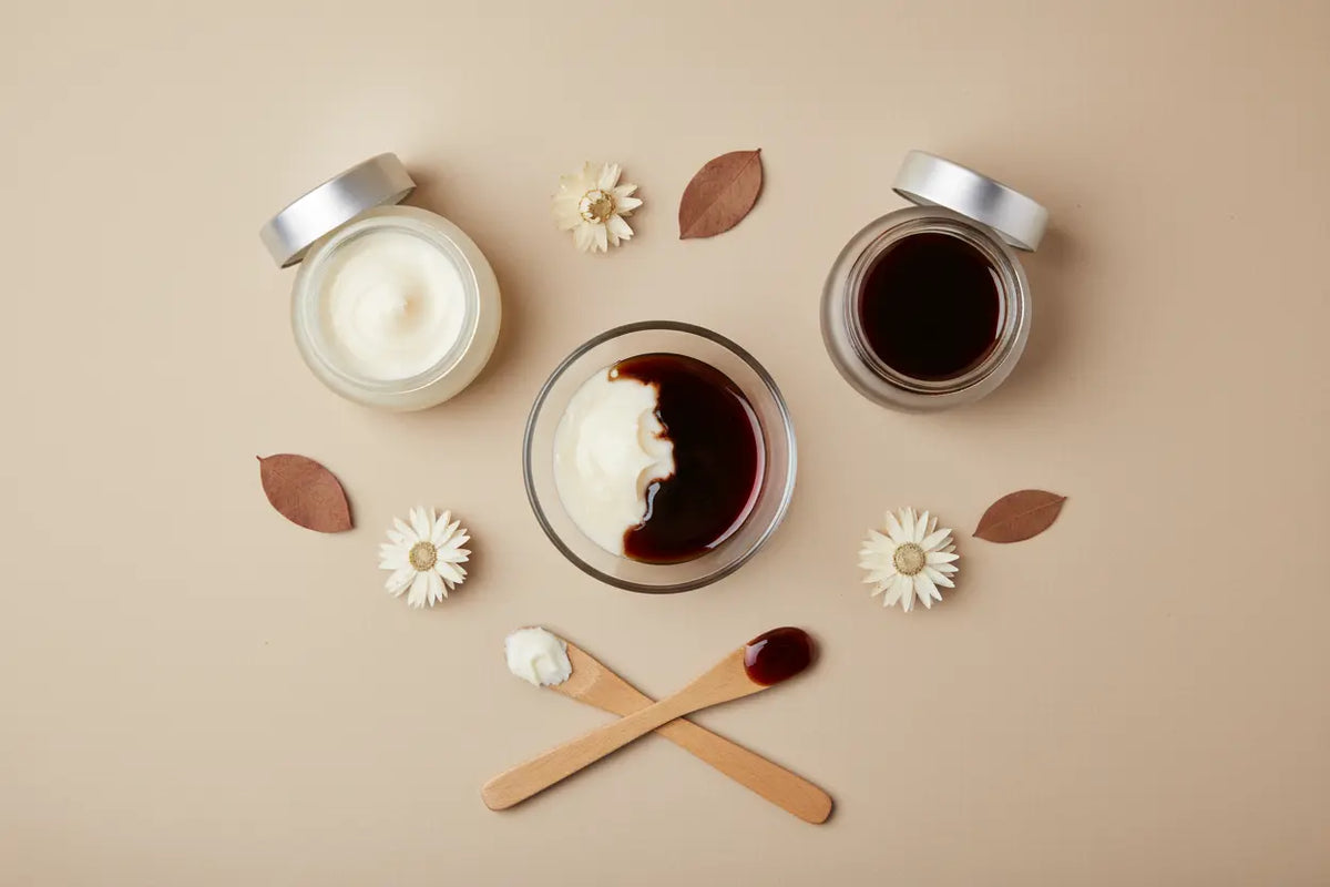 A DIY hair mask being made in a bowl with unrefined shea butter and pure batana oil to stop breakage.